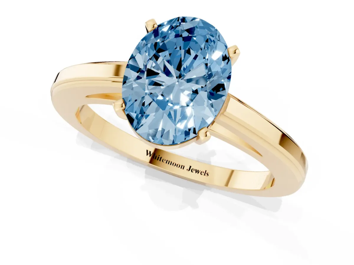 Fancy Blue Oval Cut Solitaire Diamond Ring with Four-Prong Setting and Classic Band Yellow gold
