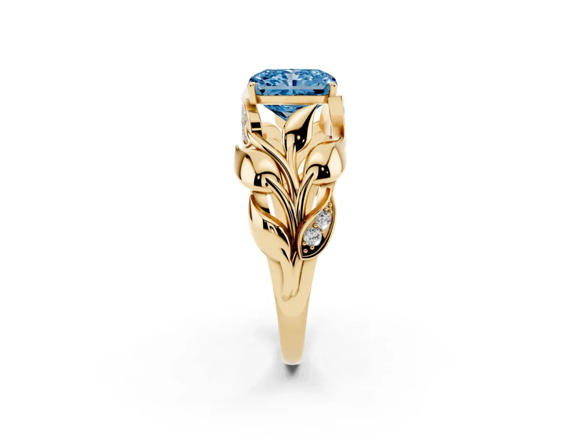 Fancy Blue Radiant Cut Diamond Leaf-Inspired Engagement Ring with Round Accents and Prong Setting Yellow gold