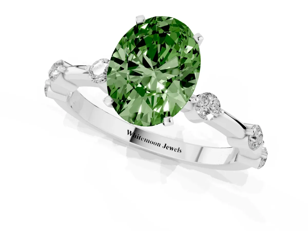Fancy Green Oval Cut Solitaire Diamond Ring with Bezel Set Side Stones and Prong Setting Silver