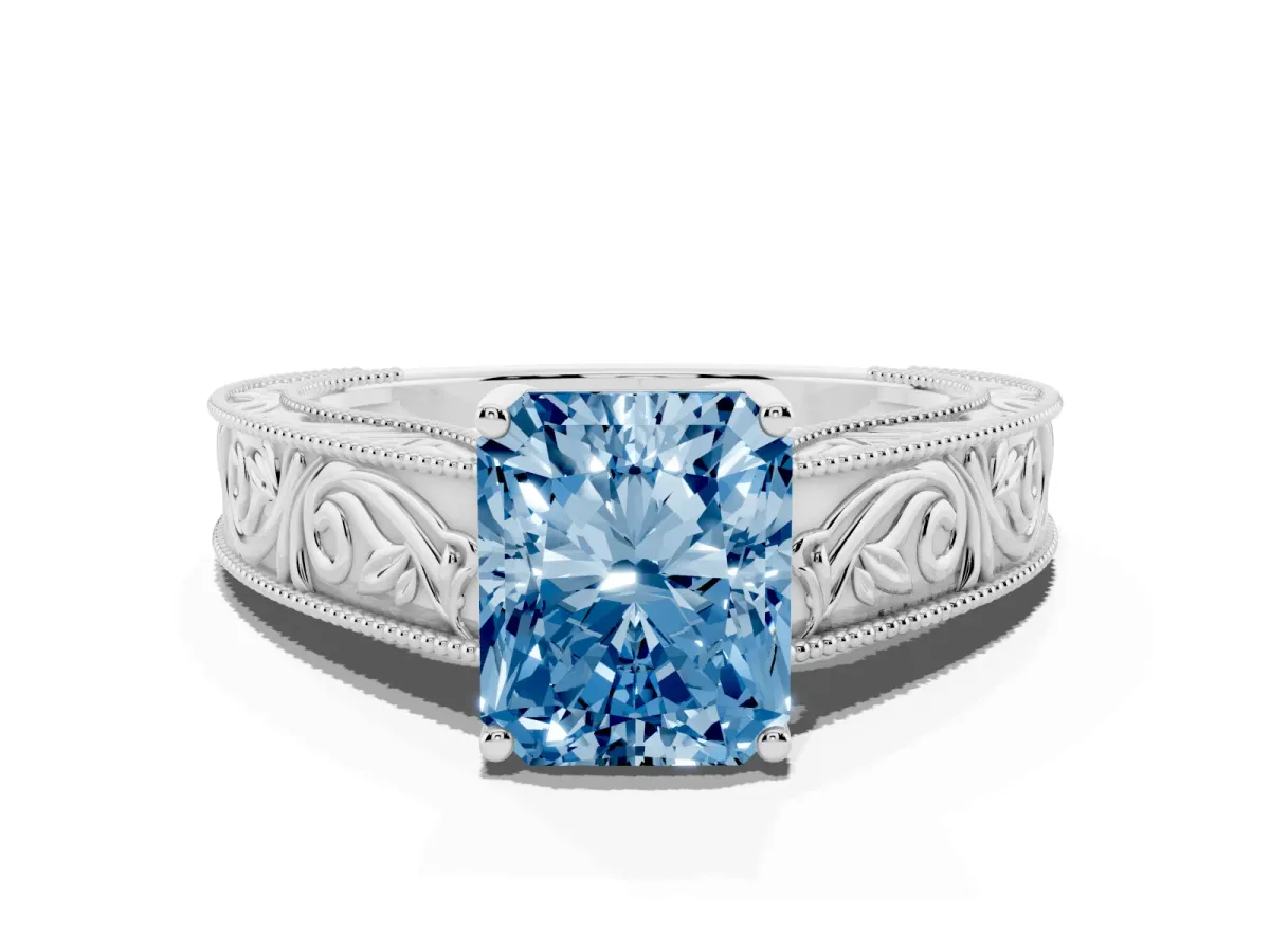 Fancy Blue Radiant Cut Diamond Solitaire Ring with Engraved Band and Four-Prong Setting White gold