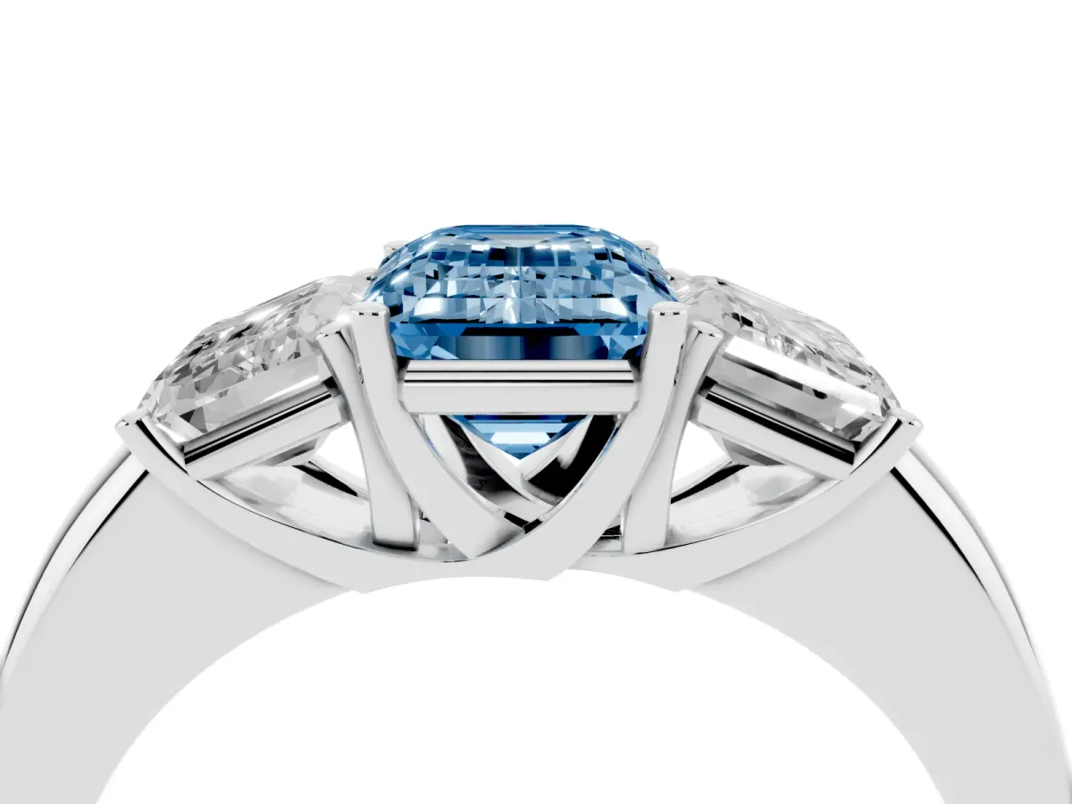 Fancy Blue Emerald Cut Diamond Three-Stone Ring with Four-Prong Setting and Classic Band Platinum
