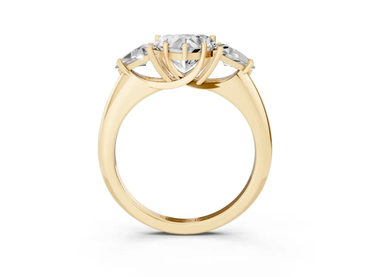 Three-Stone Heart Cut Diamond Engagement Ring with Trillion Side Stones and Prong Setting Yellow gold