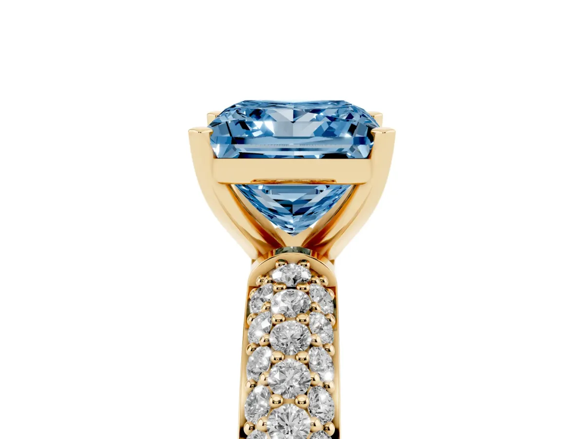 Fancy Blue Princess Cut Diamond Solitaire Ring with Prong Setting and Pavé Band Yellow gold