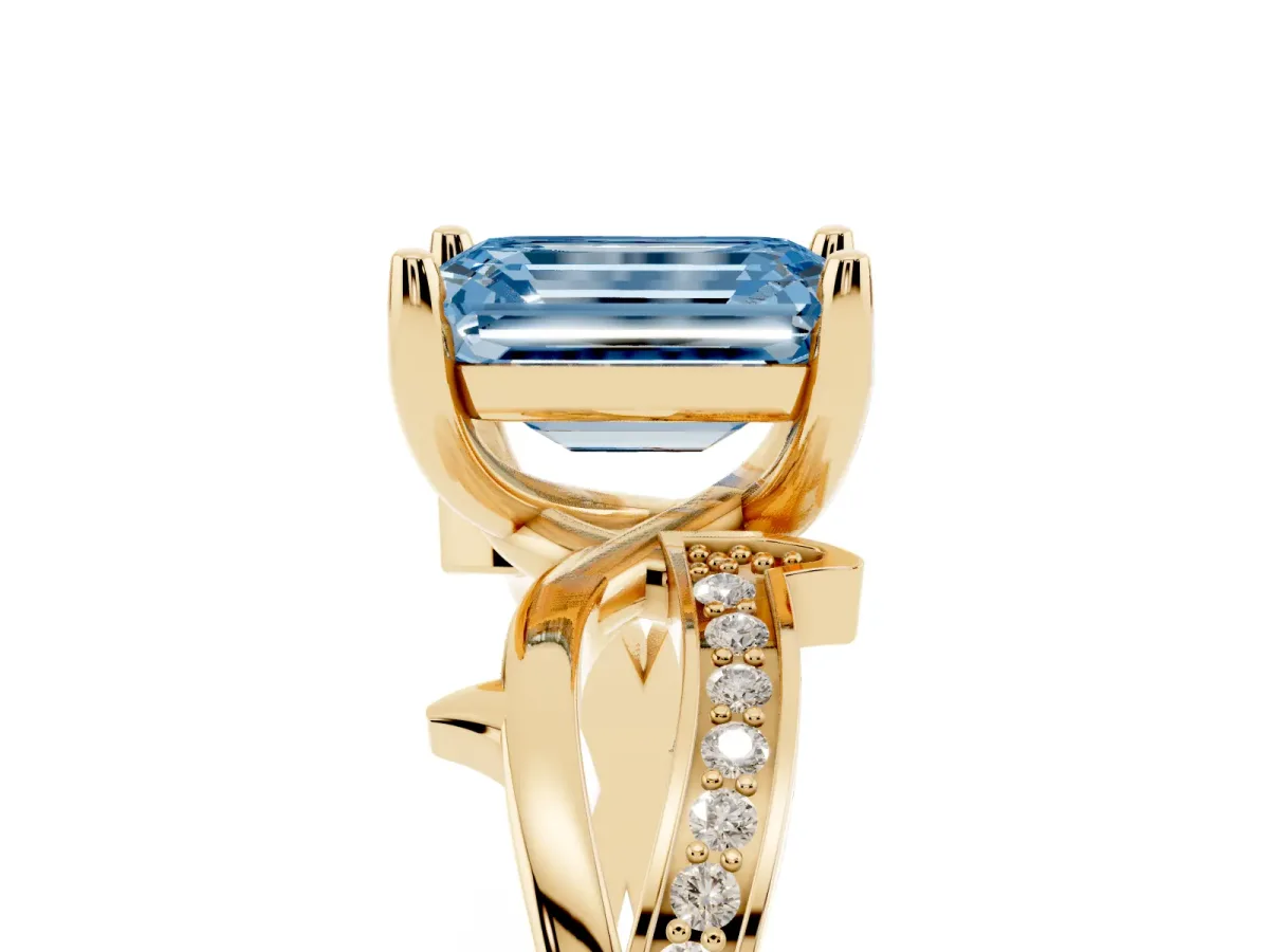 Fancy Blue Emerald Cut Solitaire Twist Band with Pavé Accents and Four-Prong Setting Yellow gold