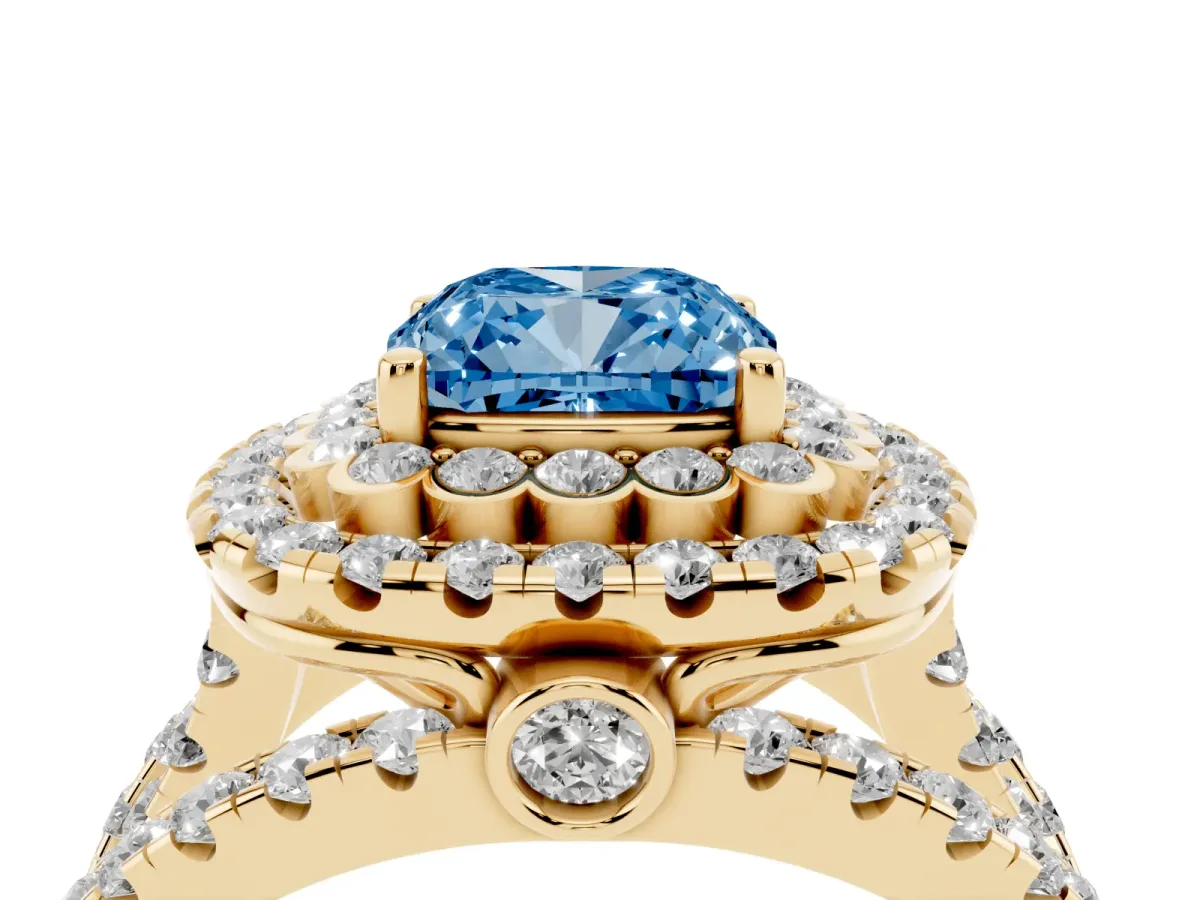 Fancy Blue Cushion Cut Diamond Double Halo Ring with Round Pavé Split Shank and Prong Setting Yellow gold