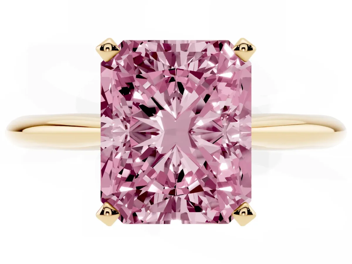Fancy Pink Radiant Cut Cut Solitaire Ring with Four-Prong Setting on a Classic Band Yellow gold
