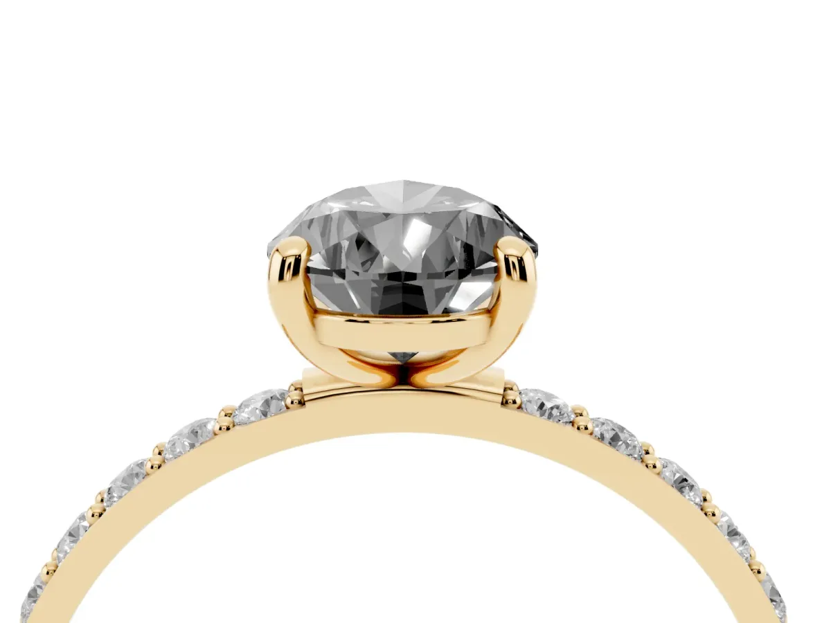 Fancy Black Pear Cut Diamond Solitaire Ring with Round Pavé Band and Prong Setting Yellow gold