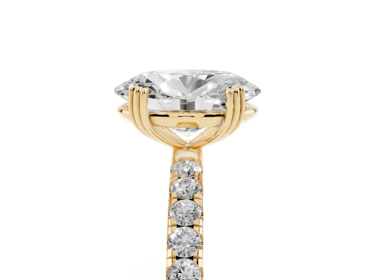 Oval Cut Brilliant Solitaire with Pavé Band and Claw Prong Setting Yellow gold