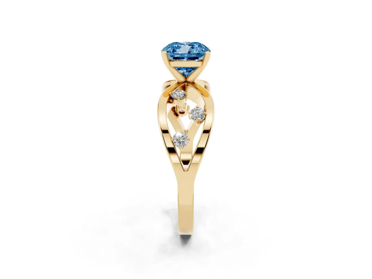Fancy Blue Cushion Cut Cut Solitaire Diamond with Side Stones on Criss-Cross Band and Four-Prong Setting Yellow gold