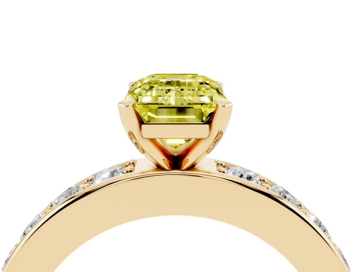 Fancy Yellow Emerald Cut Diamond Engagement Ring with Channel Set Round Band and Prong Setting Yellow gold