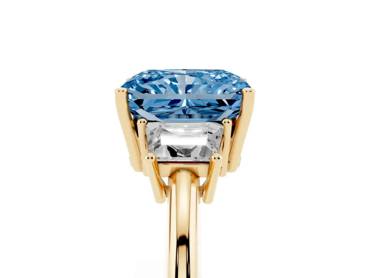 Fancy Blue Radiant Cut Diamond Three-Stone Ring with Trapezoid Side Stones and Prong Setting Yellow gold