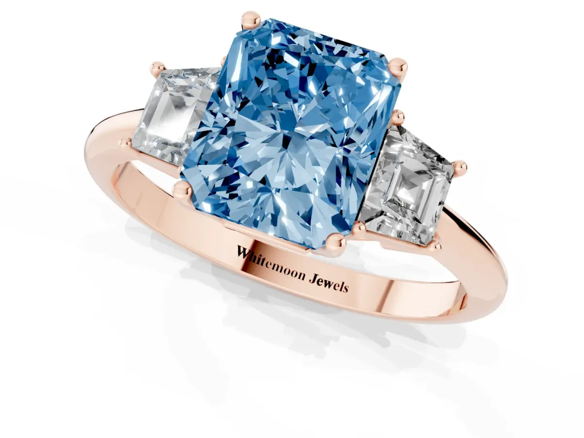 Fancy Blue Radiant Cut Diamond Three-Stone Ring with Trapezoid Side Stones and Prong Setting Rose gold