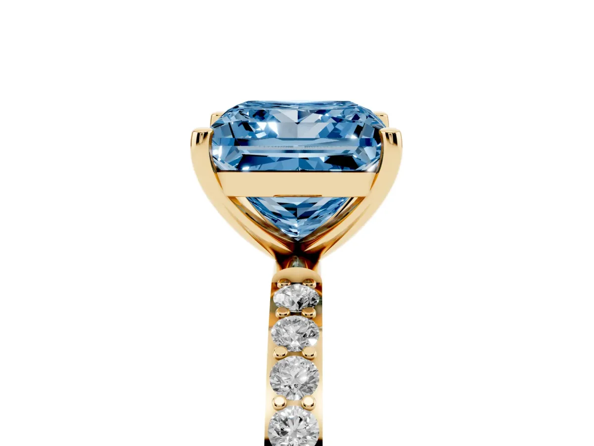 Fancy Blue Princess Cut Diamond Solitaire Ring with Round Pavé Shoulders and Prong Setting Yellow gold