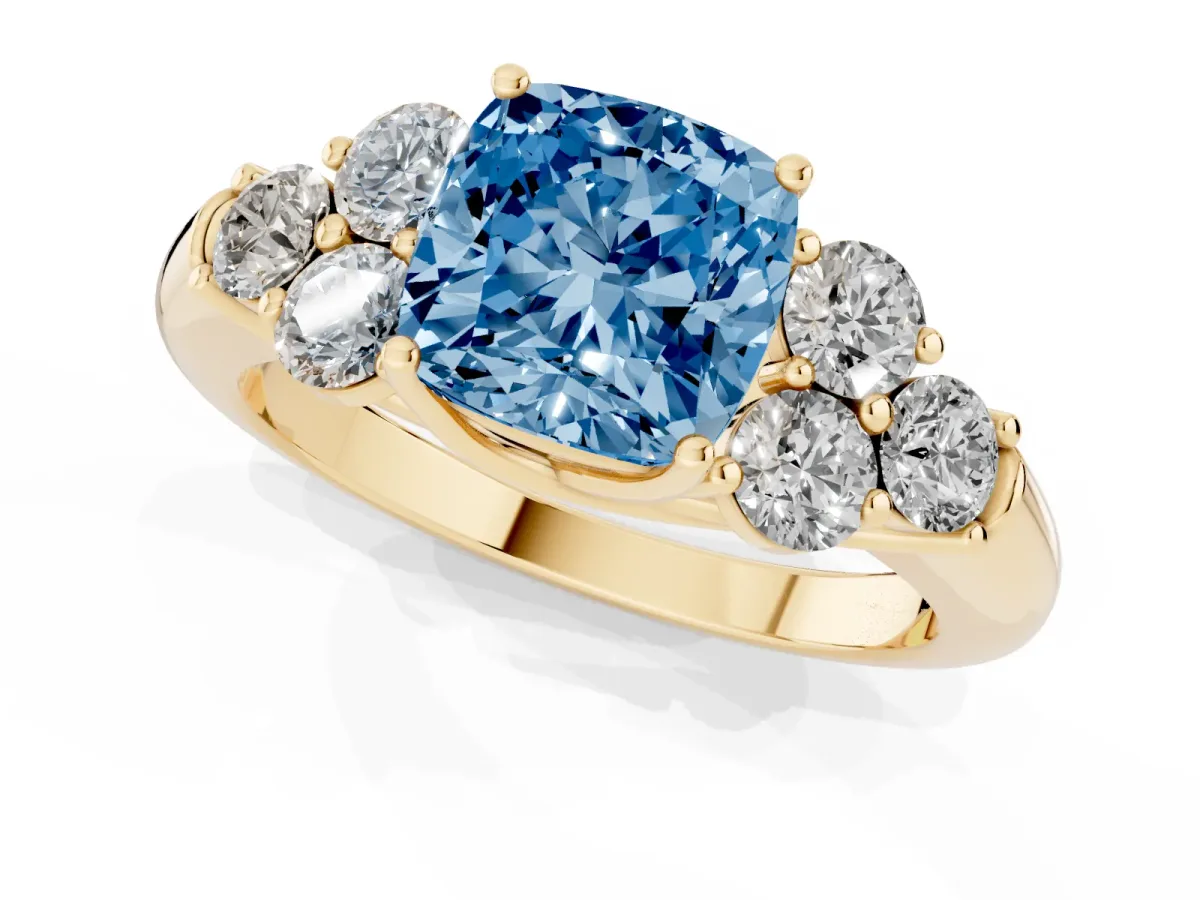 Fancy Blue Cushion Cut Cut Diamond Cluster Ring with Round Accent Stones and Prong Setting on a Classic Band Yellow gold