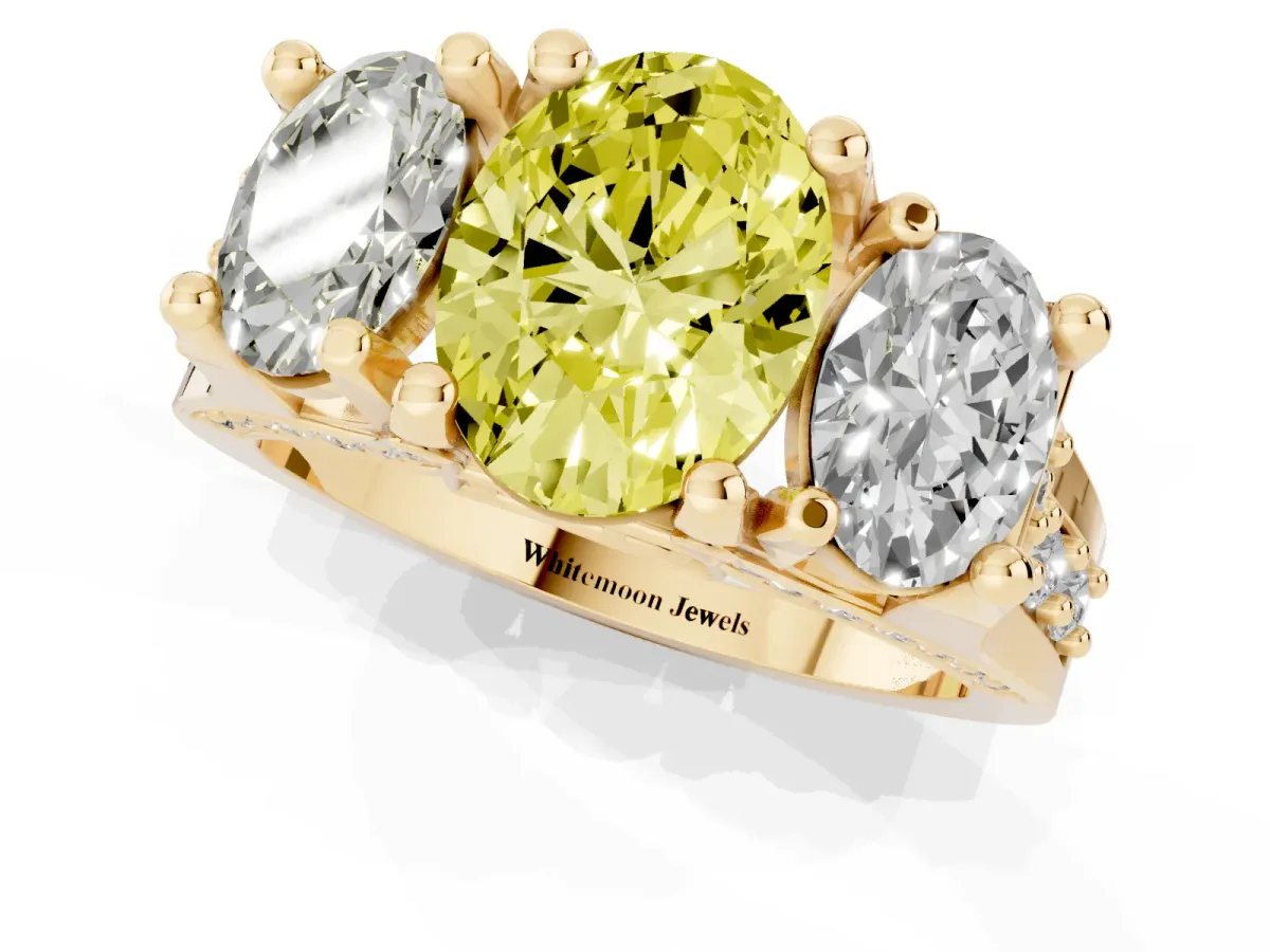 Fancy Yellow Oval Cut Diamond Three-Stone Ring with Channel Set Band and Four-Prong Setting Yellow gold