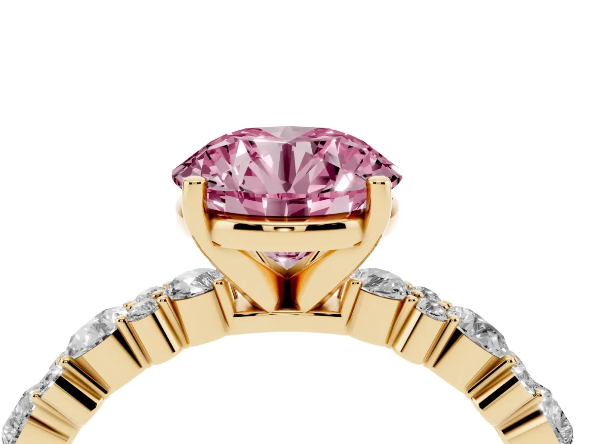 Fancy Pink Round Cut Diamond Side Stone Solitaire Ring with Round and Four-Prong Setting Yellow gold
