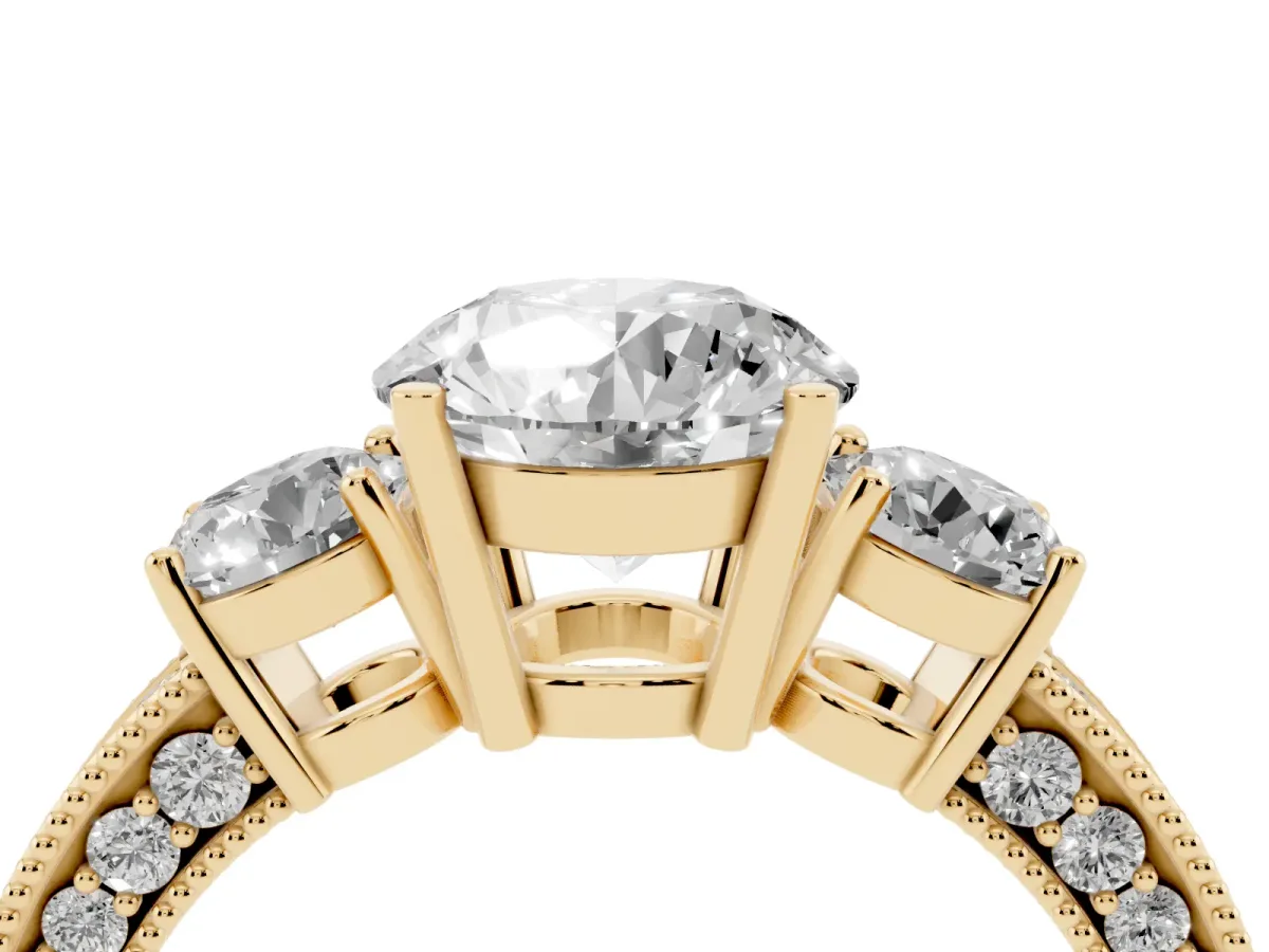 Round Cut Three-Stone Diamond Ring with Pavé Band and Four-Prong Setting Yellow gold