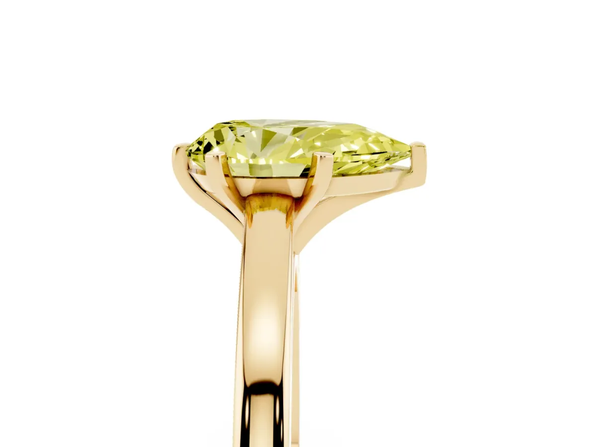 Fancy Yellow Pear Cut Solitaire Diamond Engagement Ring with Four-Prong Setting on a Classic Band Yellow gold