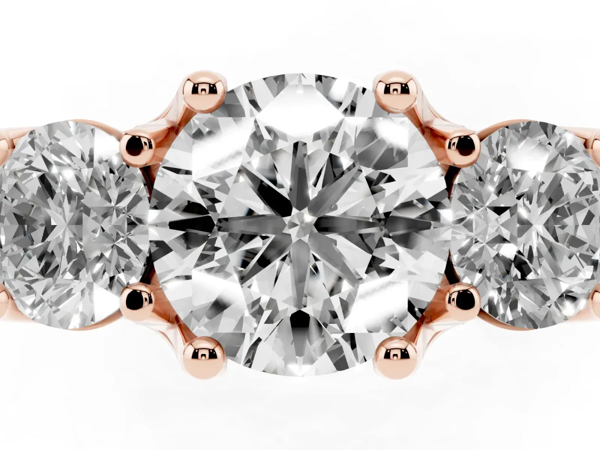 Round Cut Diamond Three-Stone Ring with Channel Set Band and Four-Prong Setting Rose gold