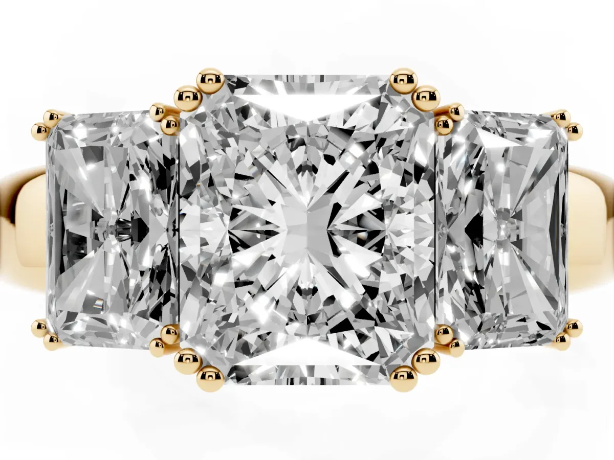 Three-Stone Radiant Cut Cut Diamond Ring with Channel Set Band and Four-Prong Setting Yellow gold