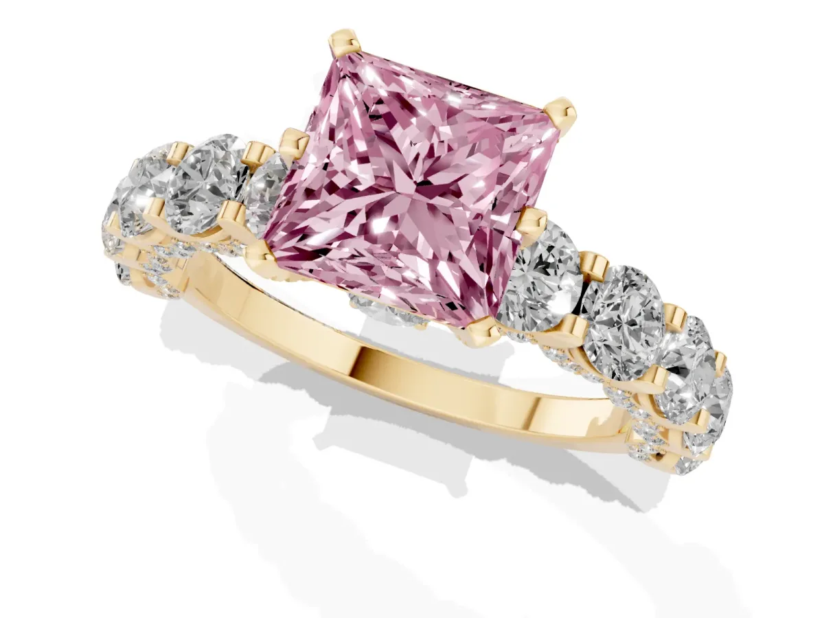 Fancy Pink Princess Cut Diamond Side Stone Engagement Ring with Four-Prong Setting Yellow gold