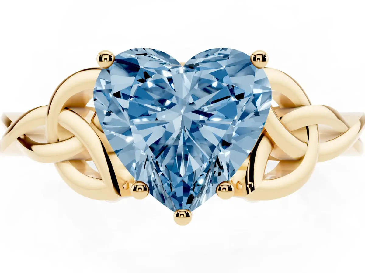 Fancy Blue Heart Cut Diamond Solitaire Engagement Ring with Celtic Knot Band and Four-Prong Setting Yellow gold