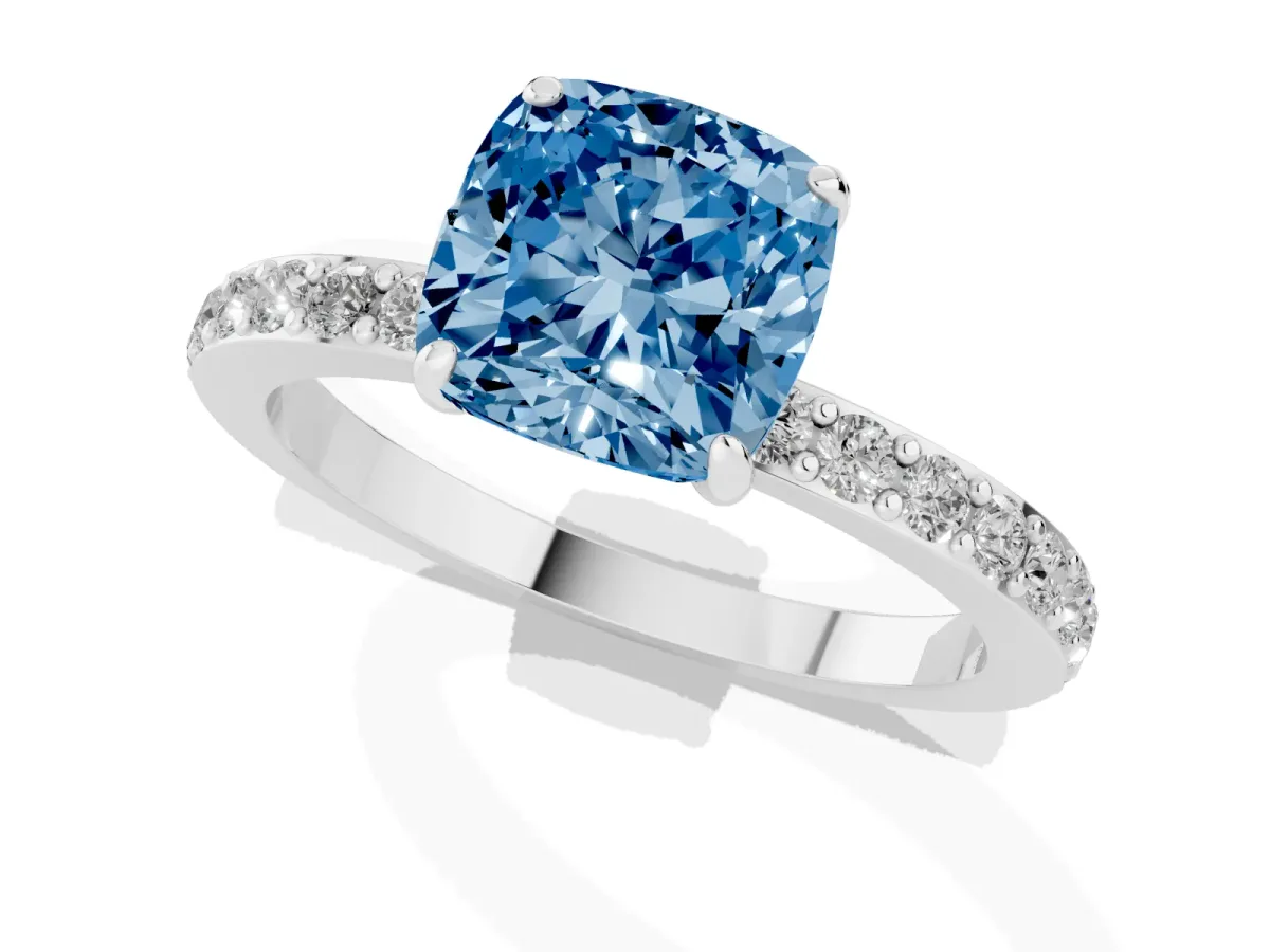 Fancy Blue Cushion Cut Diamond Solitaire Engagement Ring with Pavé Band and Four-Prong Setting Silver