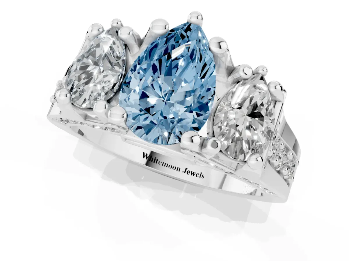 Fancy Blue Pear Cut Diamond Three-Stone Ring with Channel Set Band and Four-Prong Setting Silver