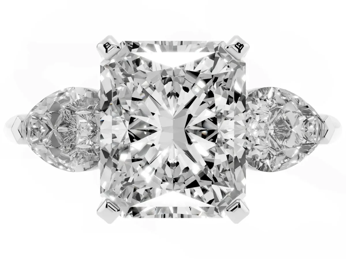 Three-Stone Radiant Cut Diamond Ring with Pear Side Stones and Four-Prong Setting Platinum