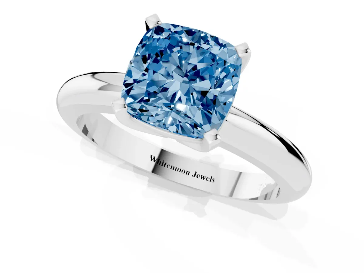 Fancy Blue Cushion Cut Diamond Solitaire Engagement Ring with Round Band and Four-Prong Setting Platinum