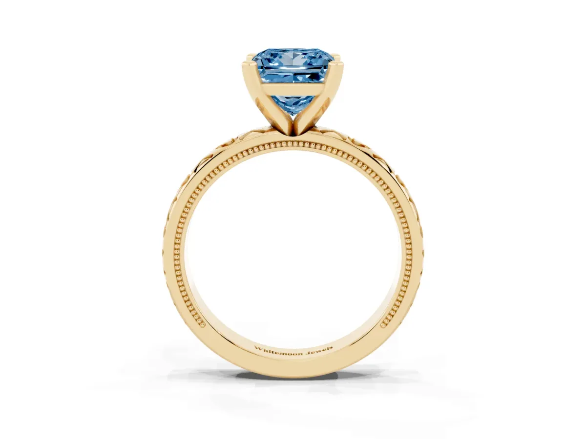 Fancy Blue Princess Cut Solitaire Diamond Engagement Ring with XO Engraved Band and Four-Prong Setting Yellow gold