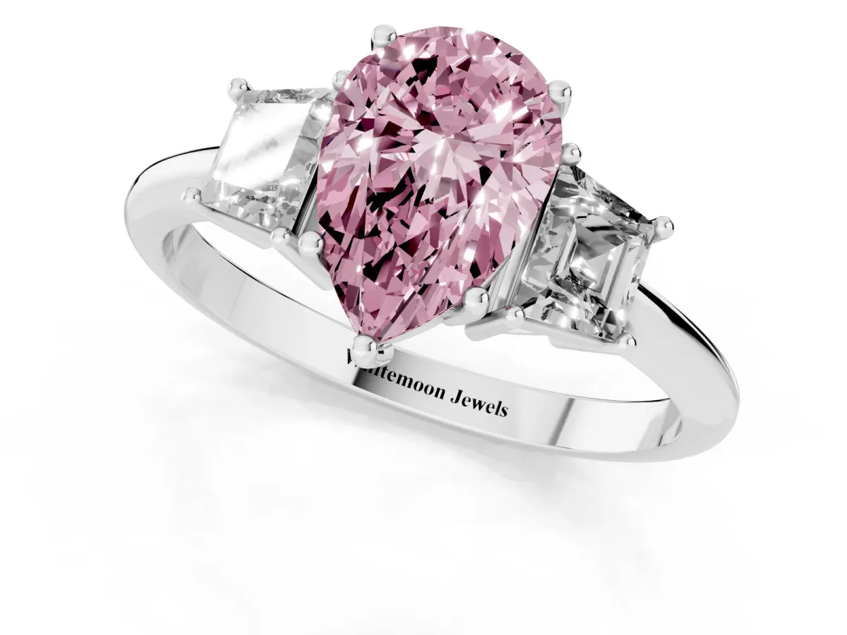 Fancy Pink Pear Cut Diamond Three-Stone Ring with Trapezoid Side Stones and Prong Setting Platinum