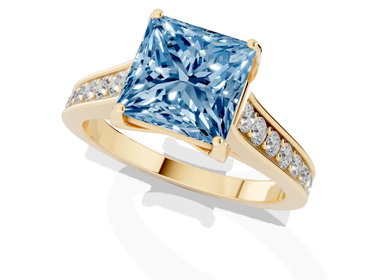 Fancy Blue Princess Cut Brilliant Cut Diamond Engagement Ring with Pavé Band and Four-Prong Setting Yellow gold