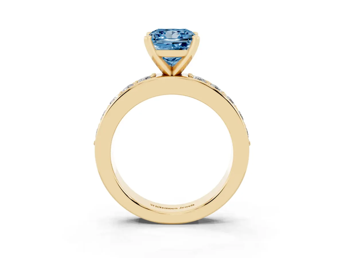 Fancy Blue Princess Cut Diamond Engagement Ring with Channel Set Round Band and Prong Setting Yellow gold