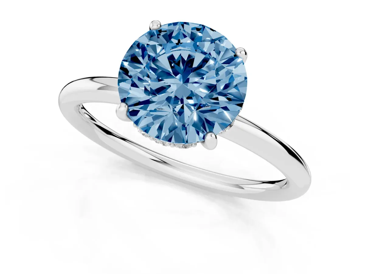 Fancy Blue Round Cut Solitaire Diamond Ring with a Classic Band and Four-Prong Setting Silver