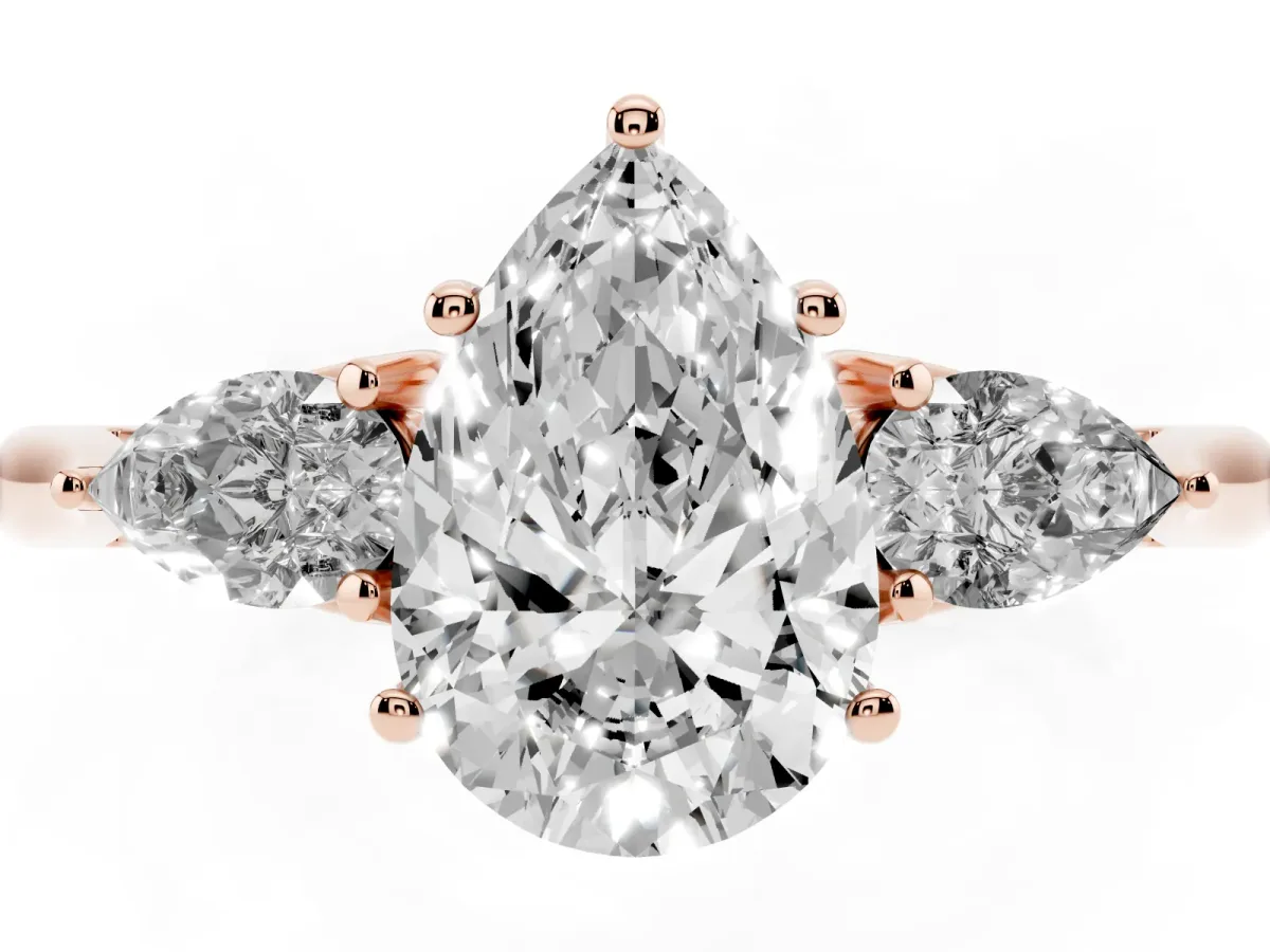 Three-Stone Pear Cut Diamond Ring with Pear Side Stones in Four-Prong Setting Rose gold
