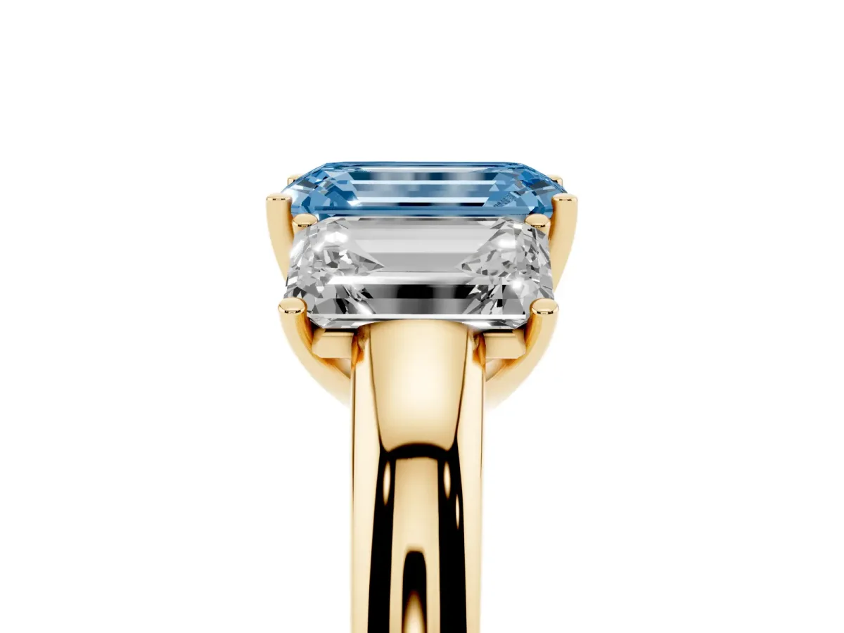 Fancy Blue Emerald Cut Diamond Three-Stone Ring with Four-Prong Setting and Classic Band Yellow gold