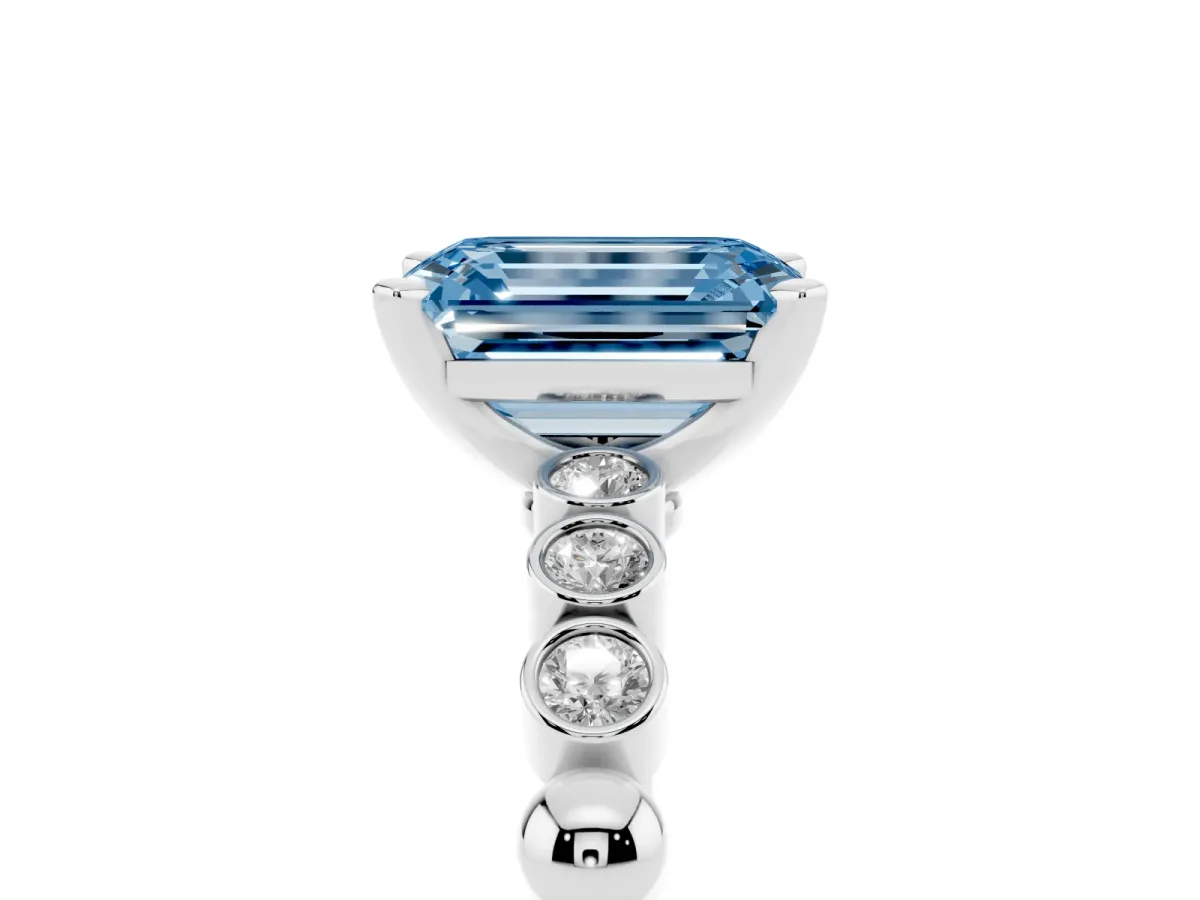 Fancy Blue Emerald Cut Solitaire Bezel Accent Diamond Engagement Ring with Beaded Band and Four-Prong Setting White gold