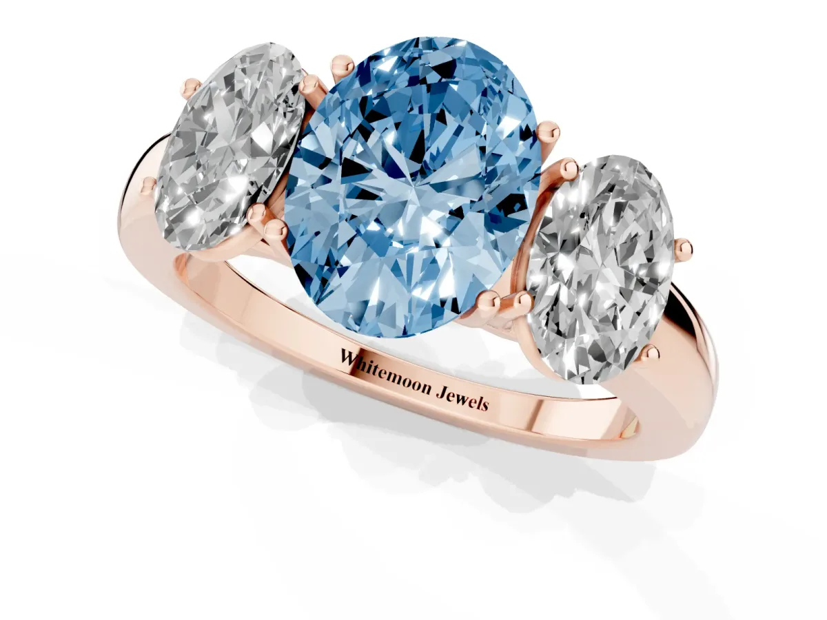 Fancy Blue Oval Cut Diamond Three-Stone Ring with Four-Prong Setting and Classic Band Rose gold