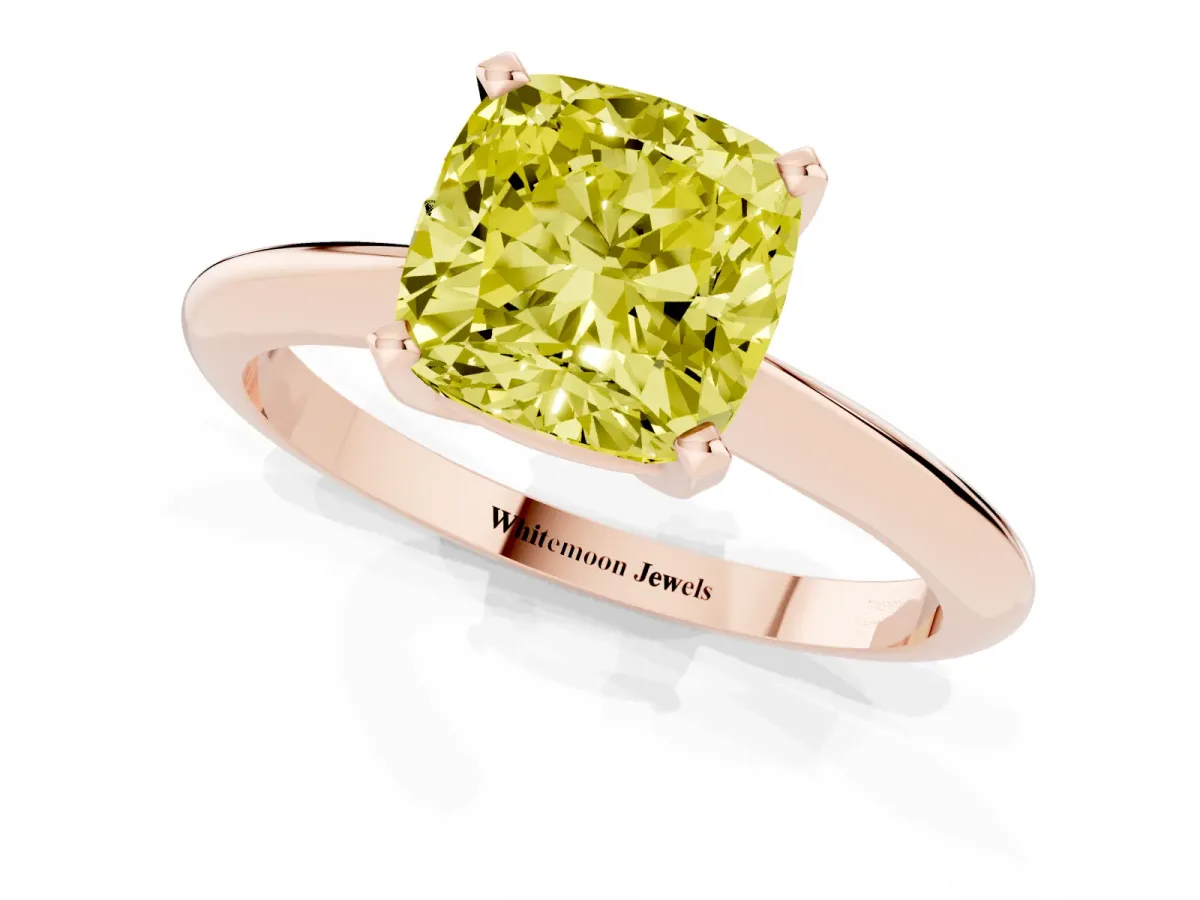 Fancy Yellow Cushion Cut Cut Solitaire Ring with Four-Prong Setting on a Classic Band Rose gold