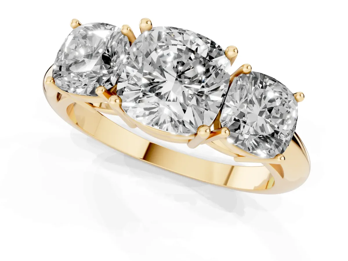 Three-Stone Cushion Cut Cut Diamond Engagement Ring with Prong Setting on a White Gold Band Yellow gold