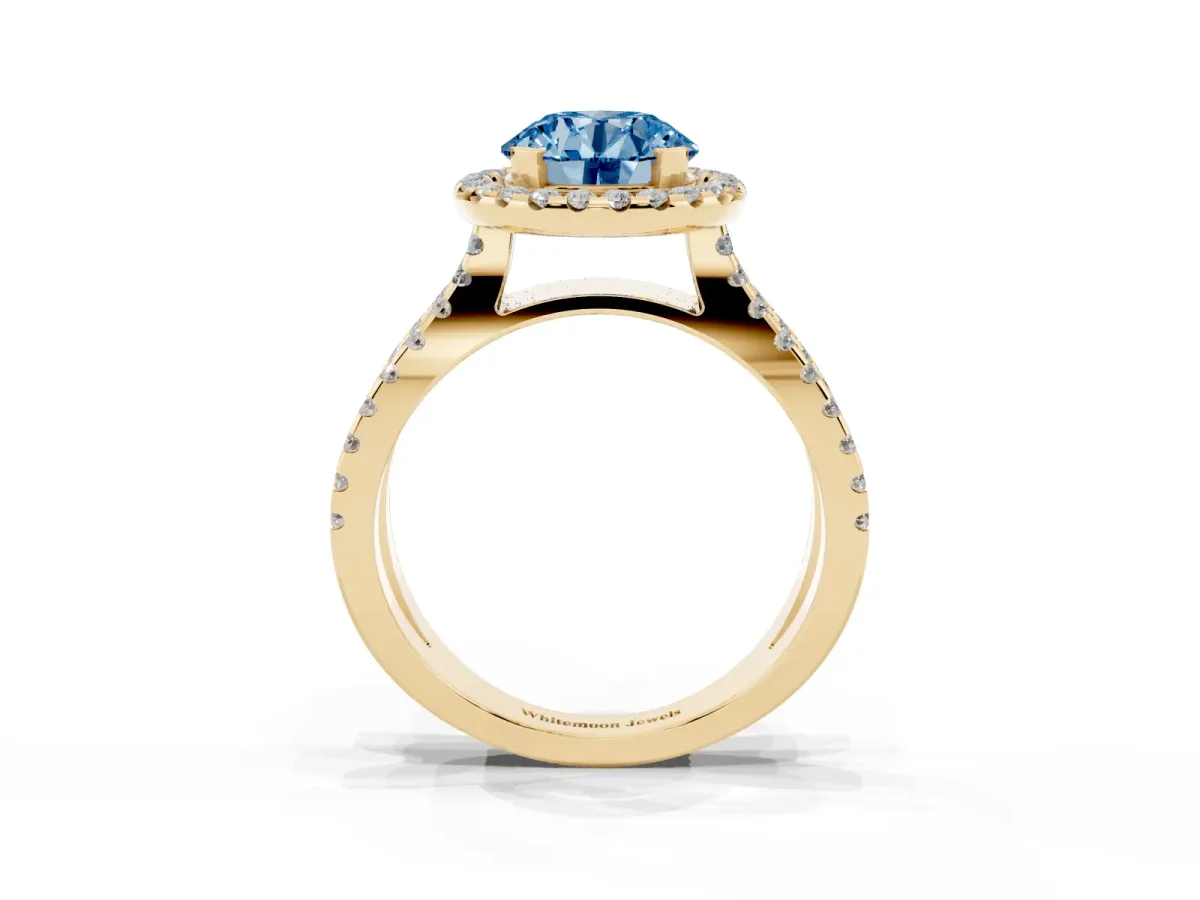 Fancy Blue Round Cut Diamond Halo Ring with Split Shank Pavé Band and Prong Setting Yellow gold