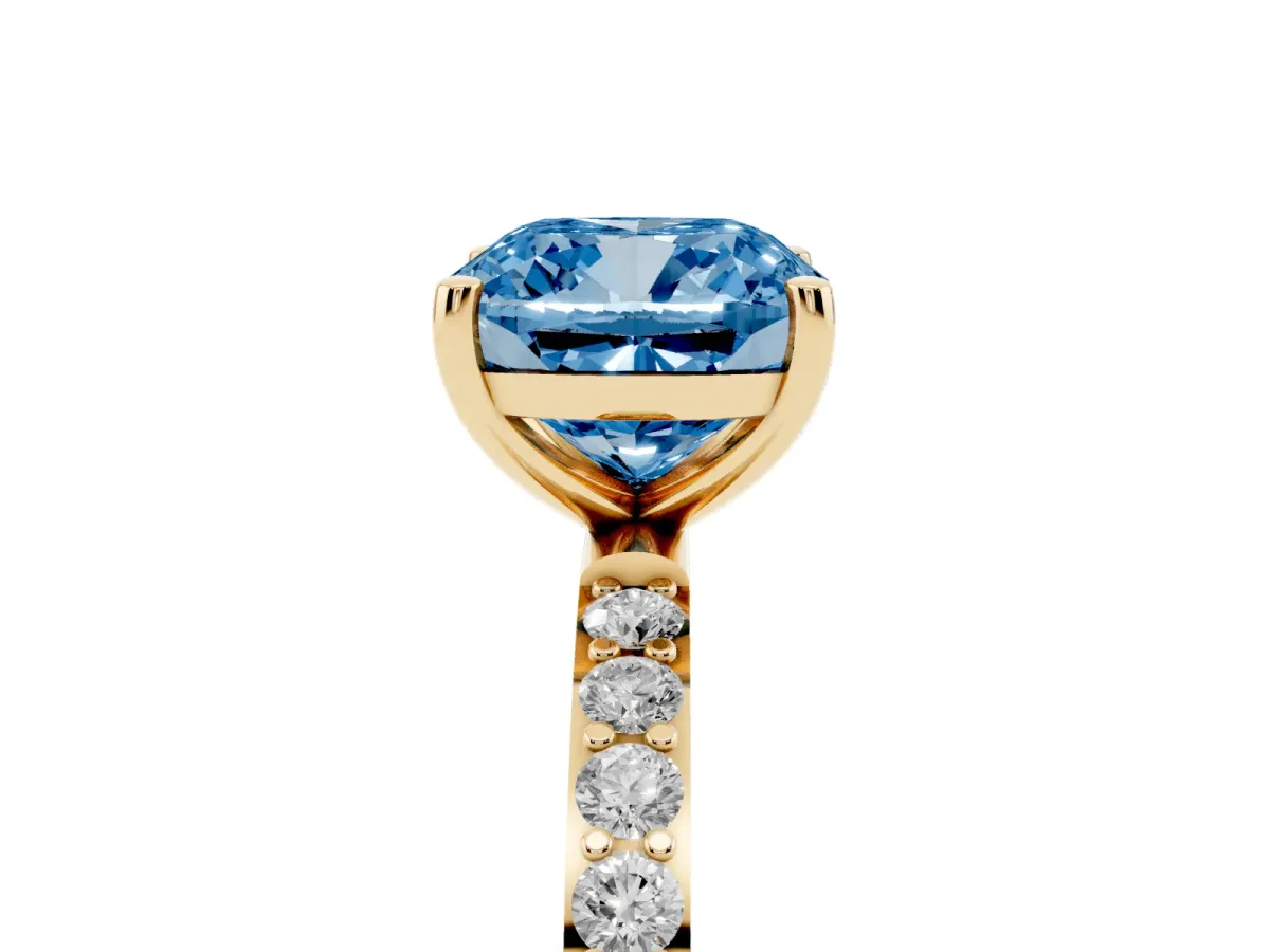 Fancy Blue Cushion Cut Diamond Solitaire Ring with Round Pavé Shoulders and Prong Setting Yellow gold