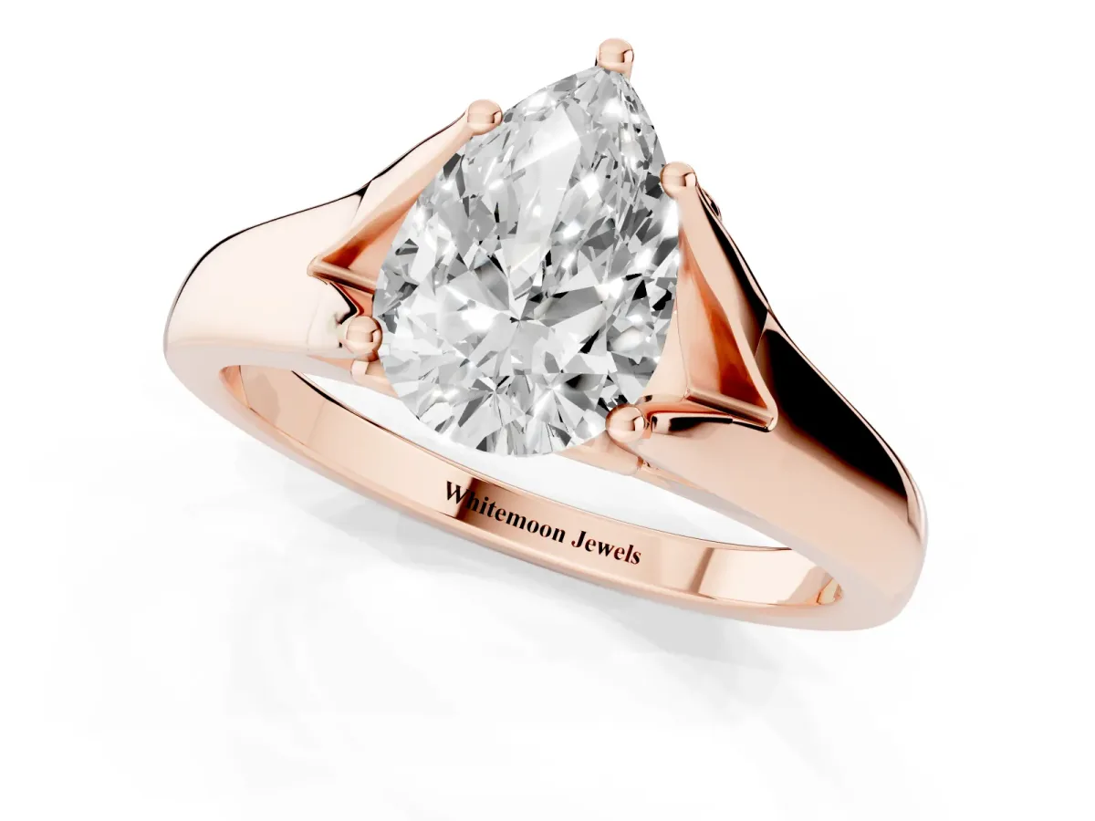 Pear Cut Solitaire Diamond Ring with Cathedral Band and Four-Prong Setting Rose gold
