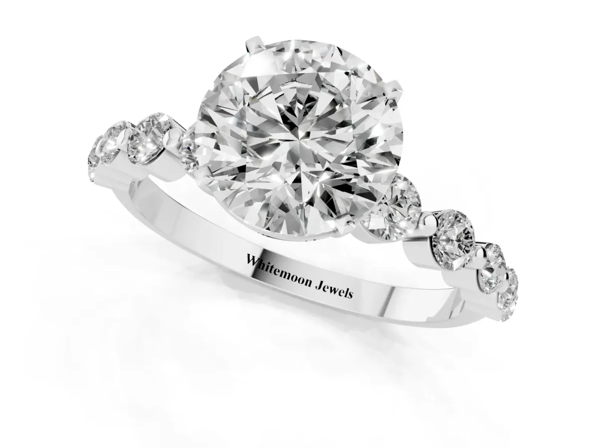 Round Cut Solitaire Diamond Ring with Pave Band and Four-Prong Setting Silver