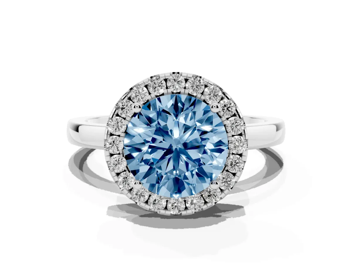 Fancy Blue Round Cut Halo Diamond Solitaire with Pavé Band and Four-Prong Setting Silver