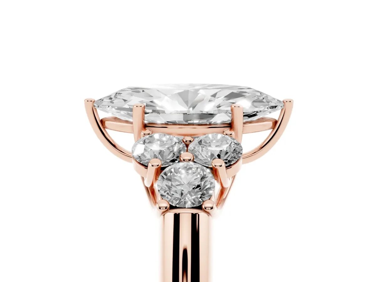 Marquise Cut Cut Diamond Cluster Ring with Round Accent Stones and Prong Setting on a Classic Band Rose gold