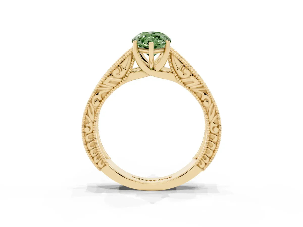Fancy Green Marquise Cut Diamond Solitaire Ring with Engraved Band and Four-Prong Setting Yellow gold