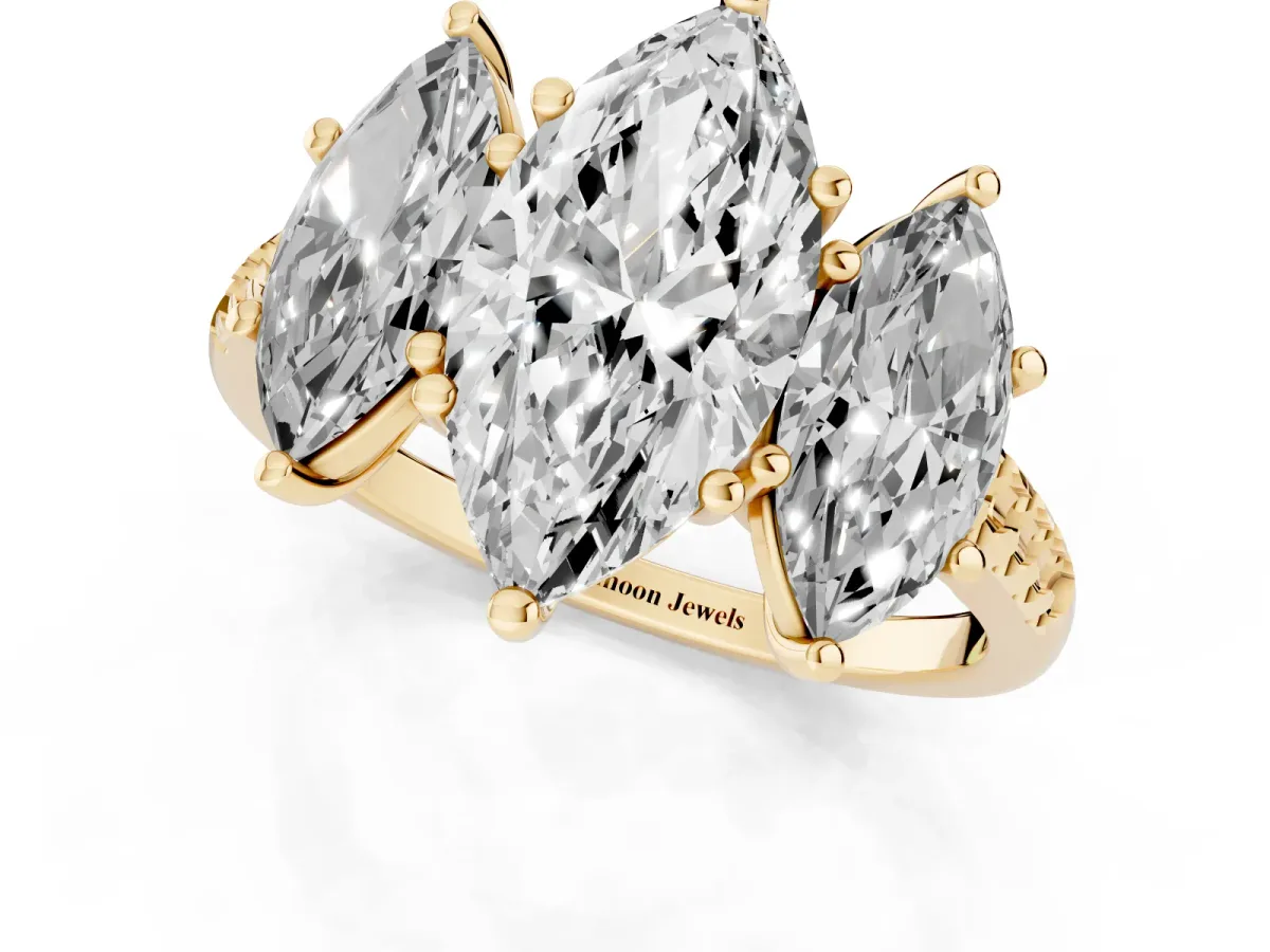 Three-Stone Marquise Cut Diamond Ring with Round Pavé Band and Prong Setting Yellow gold