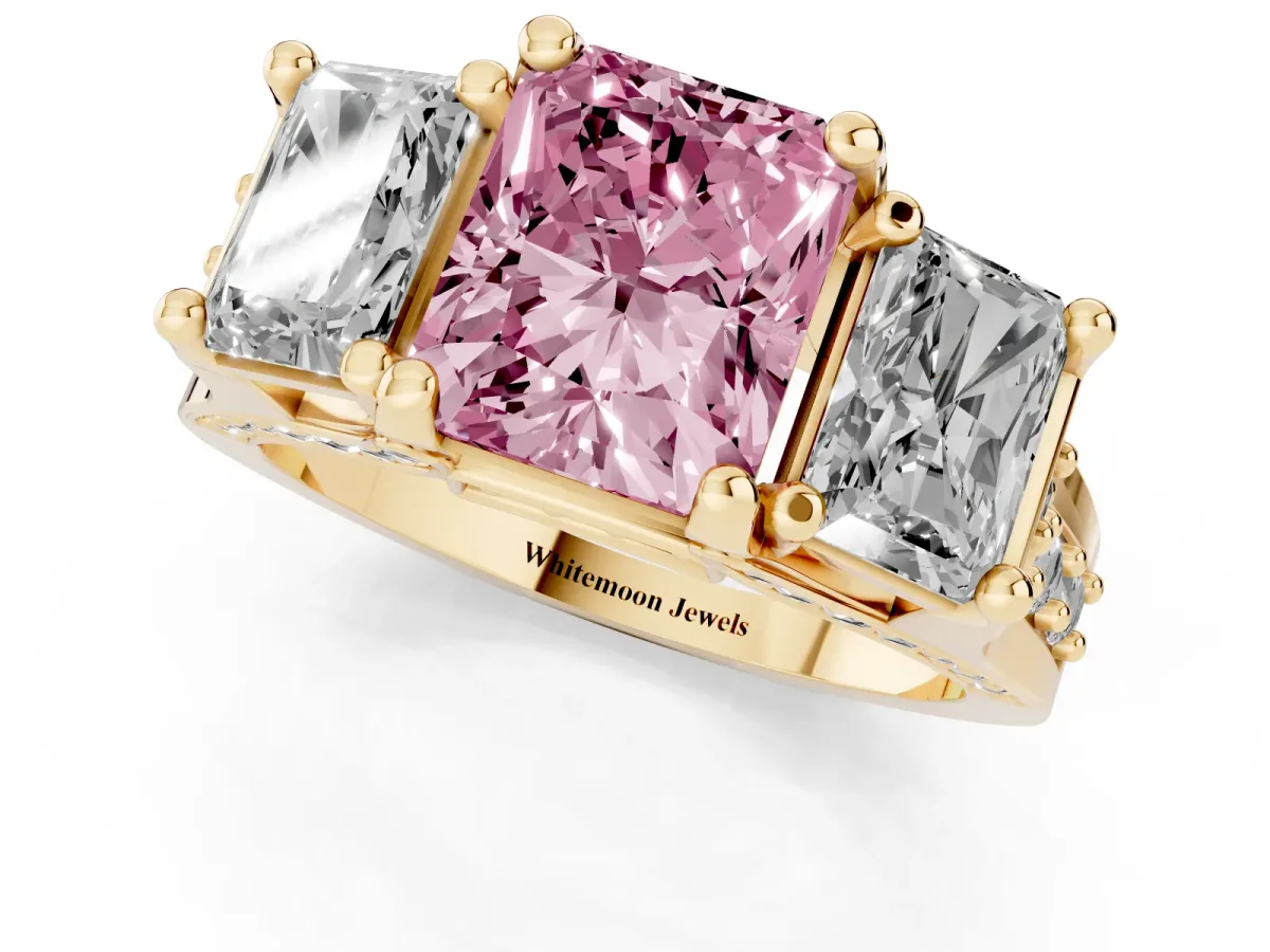 Fancy Pink Radiant Cut Diamond Three-Stone Ring with Channel Set Band and Four-Prong Setting Yellow gold